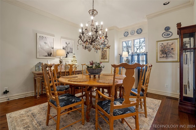 dining area with crown molding, dark hardwood / wood-style flooring, and a chandelier