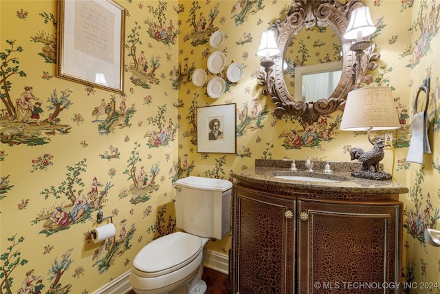 bathroom with vanity and toilet