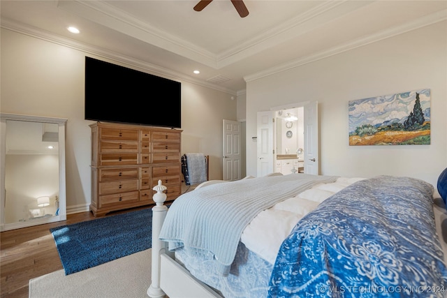 bedroom with hardwood / wood-style floors, ceiling fan, crown molding, and connected bathroom