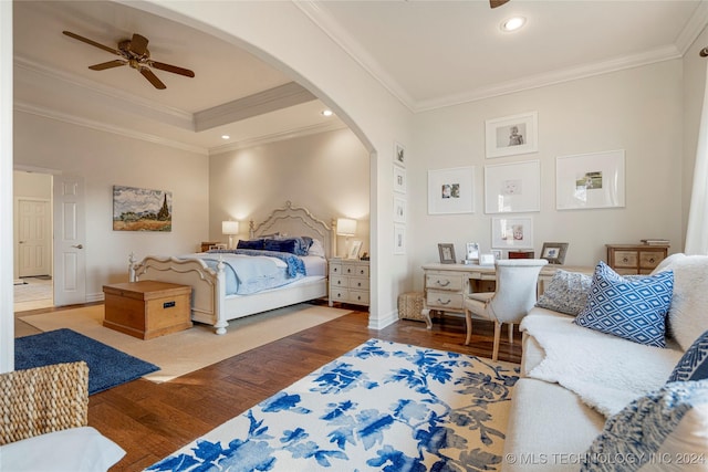 bedroom featuring hardwood / wood-style flooring, ceiling fan, and ornamental molding