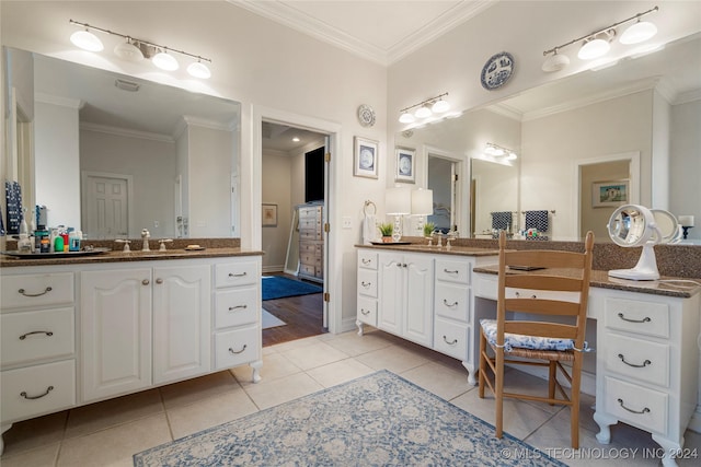 bathroom featuring tile patterned flooring, vanity, and ornamental molding