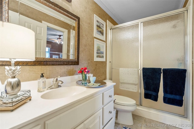 bathroom with walk in shower, tile patterned flooring, crown molding, toilet, and vanity