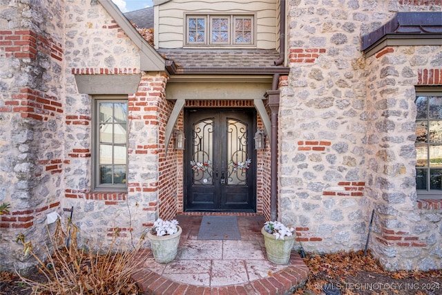 doorway to property featuring french doors