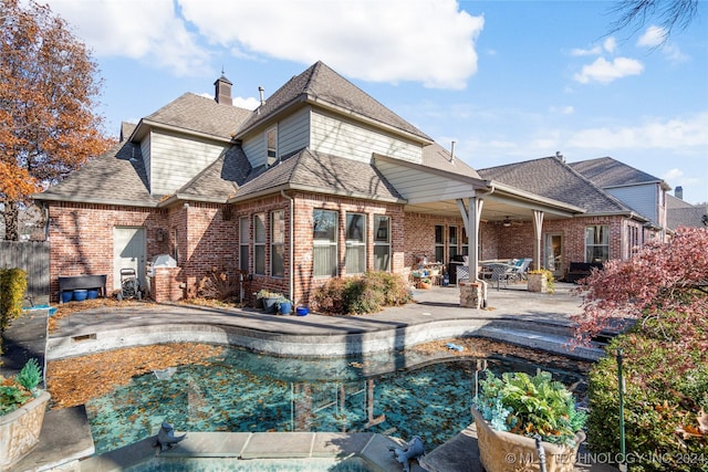 back of house featuring a patio area and ceiling fan