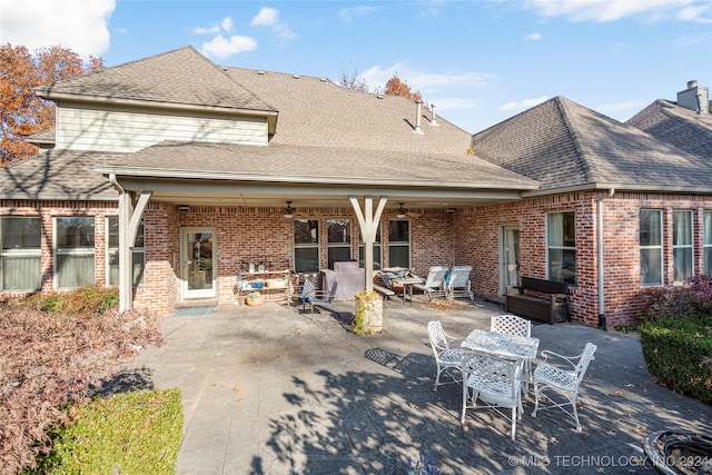 back of property with ceiling fan, an outdoor hangout area, and a patio