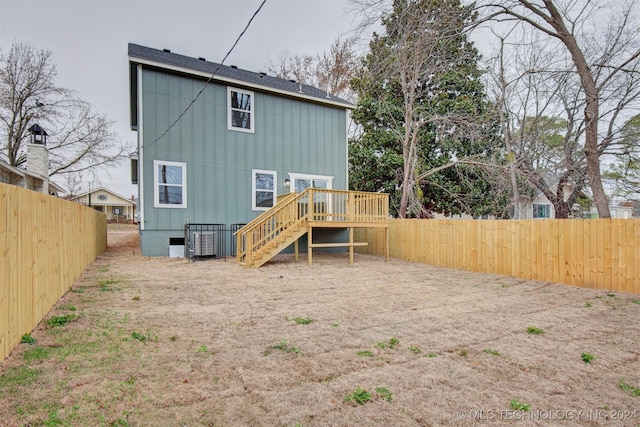 rear view of property featuring a deck