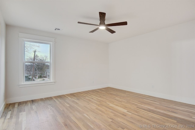 unfurnished room with ceiling fan and light hardwood / wood-style flooring