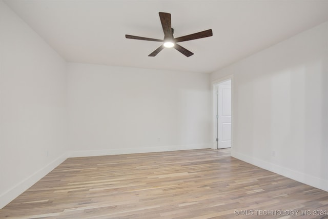 empty room featuring ceiling fan and light hardwood / wood-style flooring