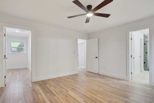 empty room featuring ceiling fan and light wood-type flooring