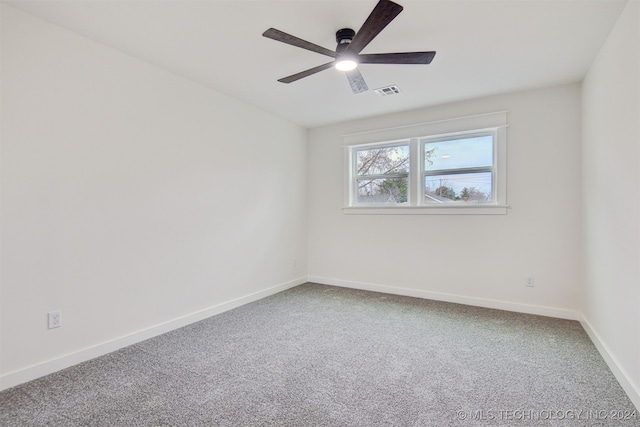 spare room with carpet and ceiling fan