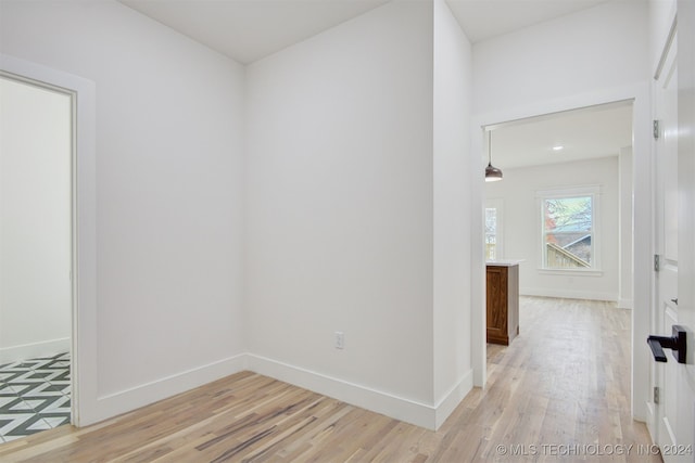 hallway with light wood-type flooring