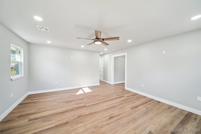 unfurnished room featuring light hardwood / wood-style flooring and ceiling fan