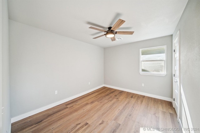 spare room featuring light hardwood / wood-style flooring and ceiling fan