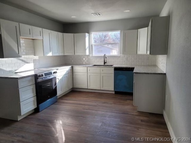 kitchen featuring white cabinetry, dishwashing machine, and dark hardwood / wood-style floors