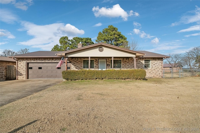 single story home with a garage and a front yard