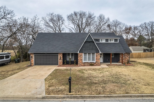 view of front facade with a garage and a front lawn