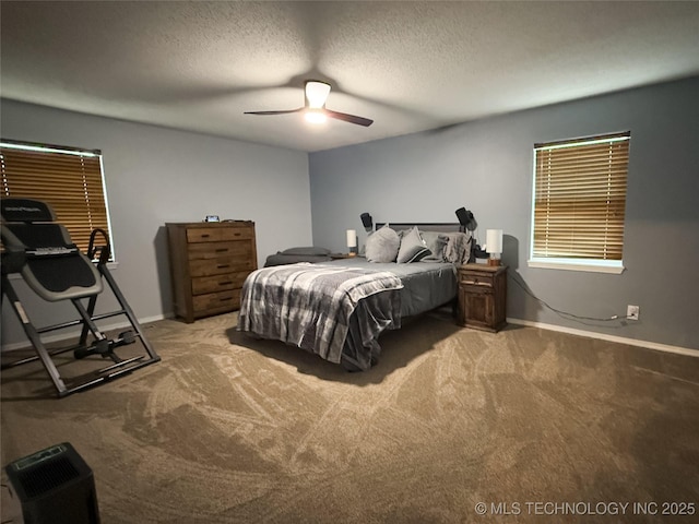 bedroom with a textured ceiling, carpet flooring, a ceiling fan, and baseboards