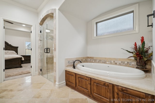 bathroom with plus walk in shower, lofted ceiling, tile patterned floors, and crown molding