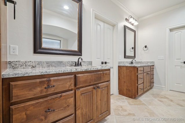 bathroom with vanity and ornamental molding