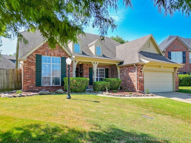 view of front of house with covered porch and a front yard