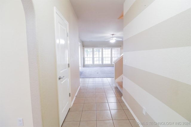 hall with light tile patterned flooring