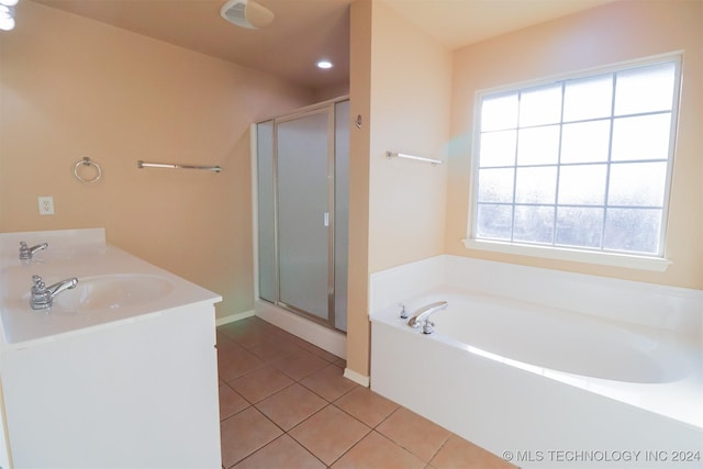 bathroom with shower with separate bathtub, tile patterned floors, and plenty of natural light