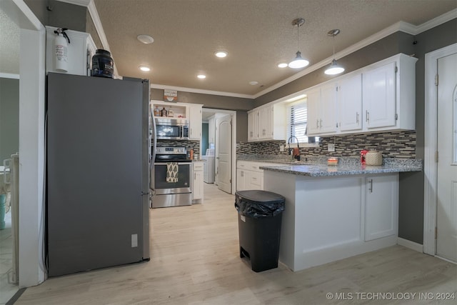 kitchen featuring backsplash, light hardwood / wood-style flooring, white cabinets, and appliances with stainless steel finishes