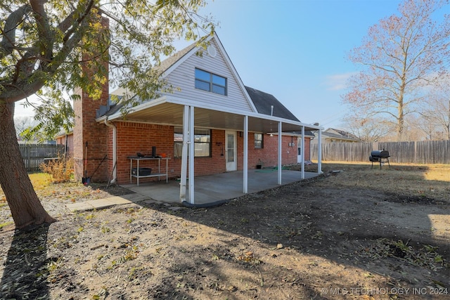 back of property featuring a patio