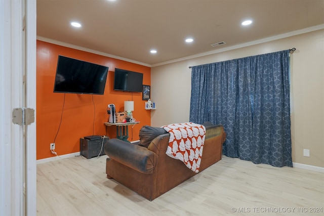 living room featuring wood-type flooring and crown molding