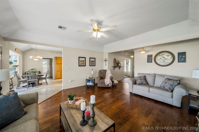 living room with lofted ceiling, a wealth of natural light, wood-type flooring, and ceiling fan with notable chandelier