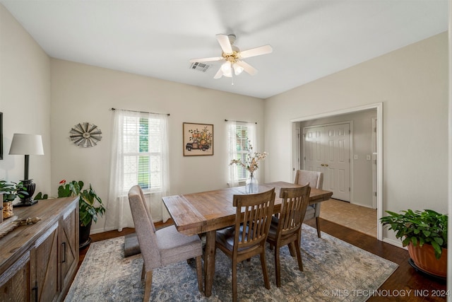 dining area with ceiling fan and wood-type flooring