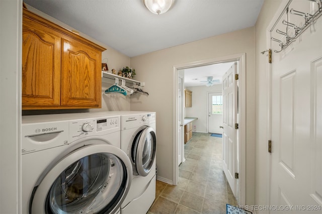 washroom with cabinets, ceiling fan, and washing machine and dryer