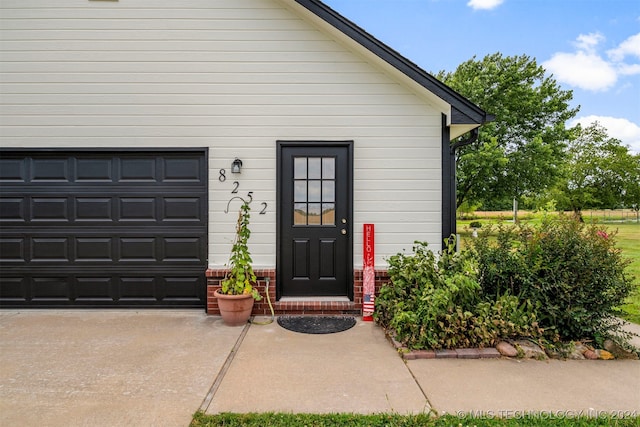 property entrance featuring a garage