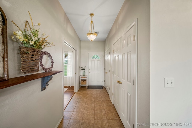 entryway with tile patterned floors