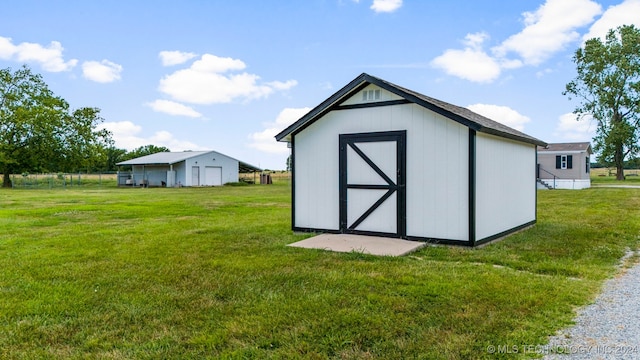 view of outdoor structure with a lawn