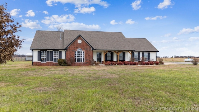 view of front of property with a front lawn