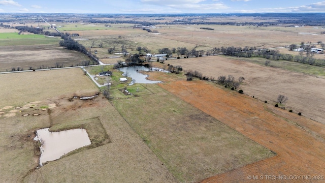 birds eye view of property with a water view and a rural view