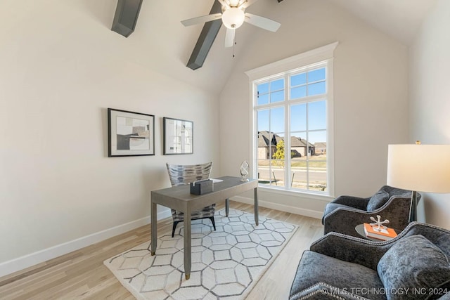 office area with light wood-type flooring, high vaulted ceiling, and ceiling fan