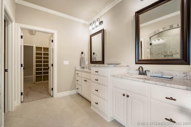 bathroom featuring tile patterned flooring, vanity, and ornamental molding