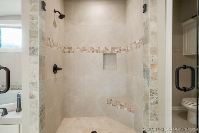 bathroom with toilet and walk in shower