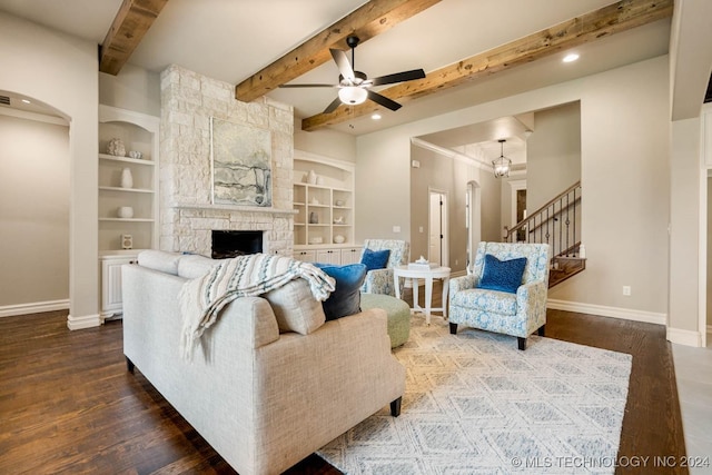 living room with hardwood / wood-style floors, built in shelves, and beam ceiling