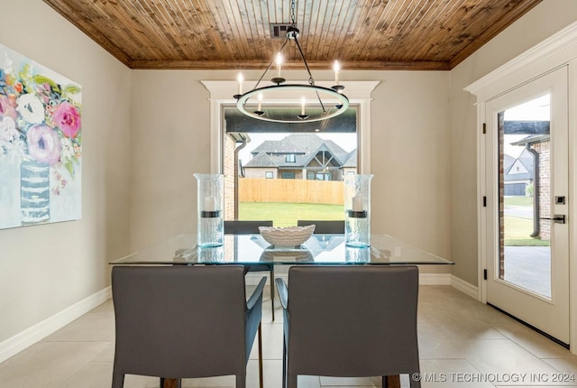 dining room with light tile patterned floors, crown molding, wooden ceiling, and a notable chandelier