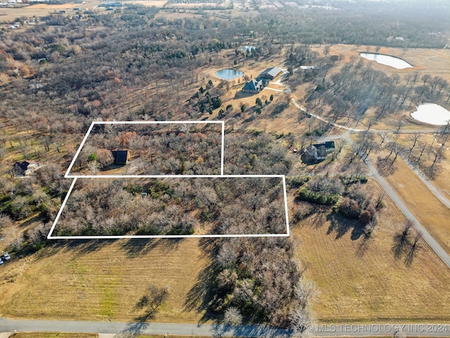 birds eye view of property with a rural view