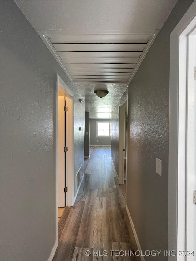 corridor featuring wood-type flooring