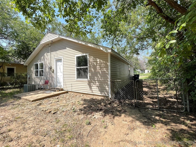 back of property with cooling unit