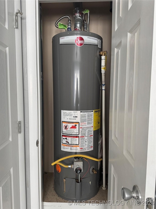 utility room featuring water heater