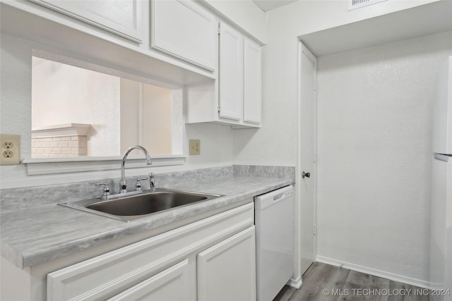 kitchen featuring dishwasher, wood-type flooring, white cabinets, and sink