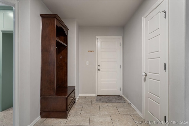 mudroom with light tile patterned floors