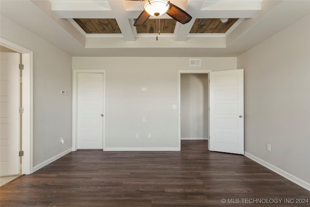 spare room with beamed ceiling, ceiling fan, and dark hardwood / wood-style flooring