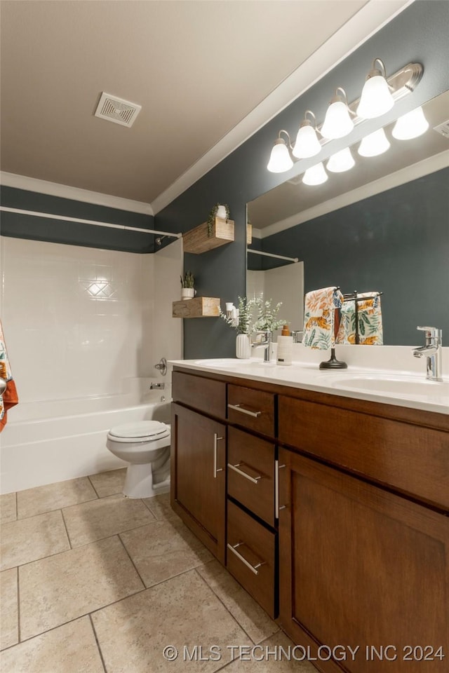 full bathroom with vanity, toilet, tiled shower / bath, and crown molding